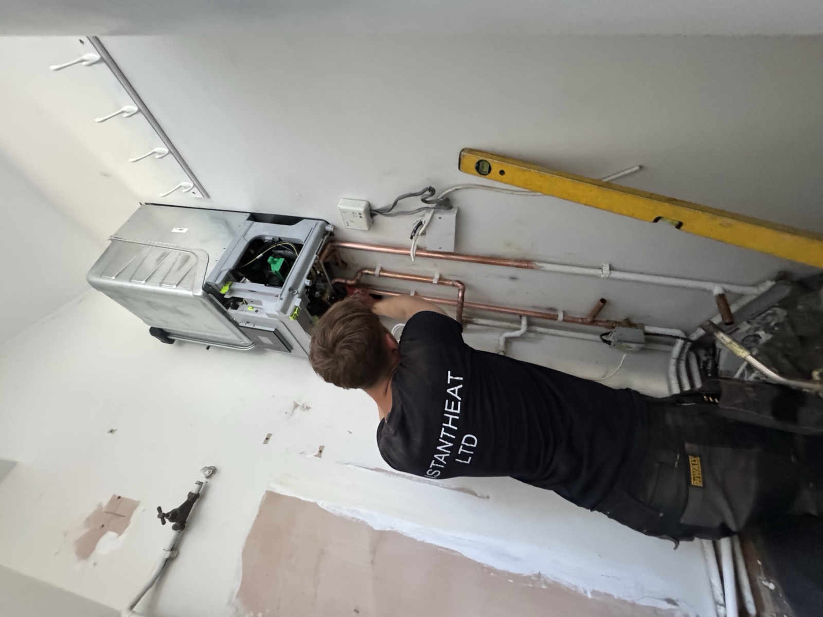 Instantheat engineer fitting a new combi boiler